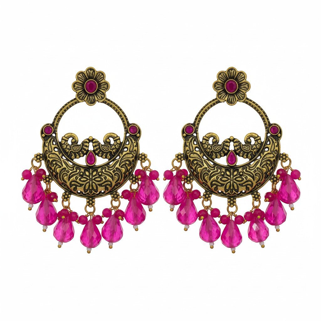 Naanu antique gold chandbali earrings with intricate peacock motifs, pink stones, and pink jade drops.