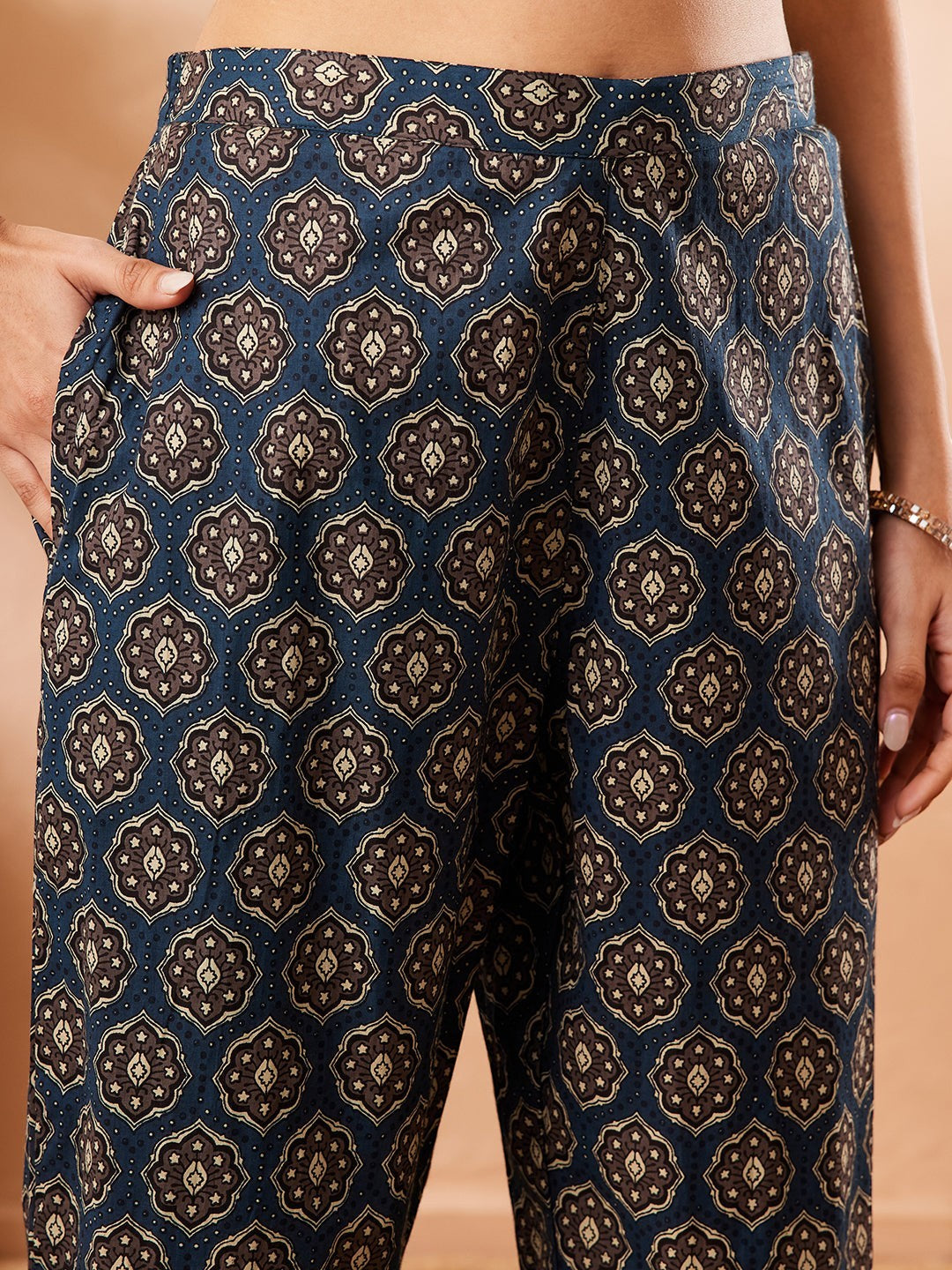 Naanu beige cotton co-ord set top with embroidered yoke and navy Ajrakh print palazzo pants.