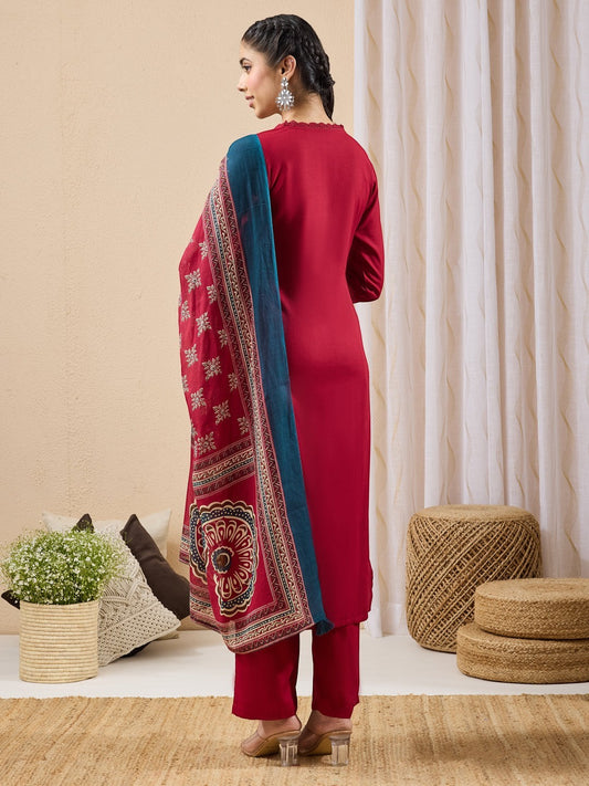 Naanu crimson red 3-piece kurta set with lace trim, straight pants, and printed dupatta with teal border.