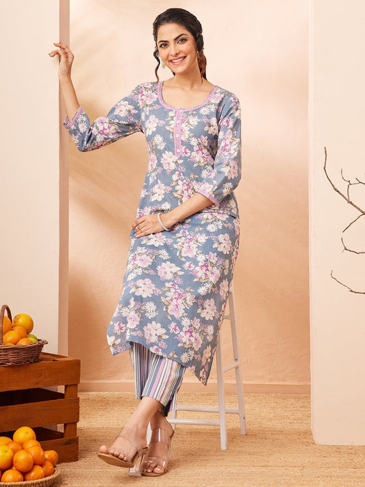 Naanu dusty blue floral print kurta with pink lace trim and striped pants. 3/4 sleeves, round neck.