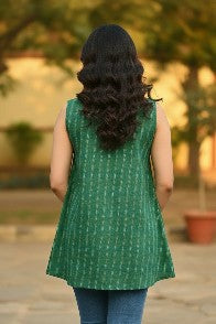 Naanu emerald green cotton ikat sleeveless boxy top with white and golden diagonal stripes and curved hem.