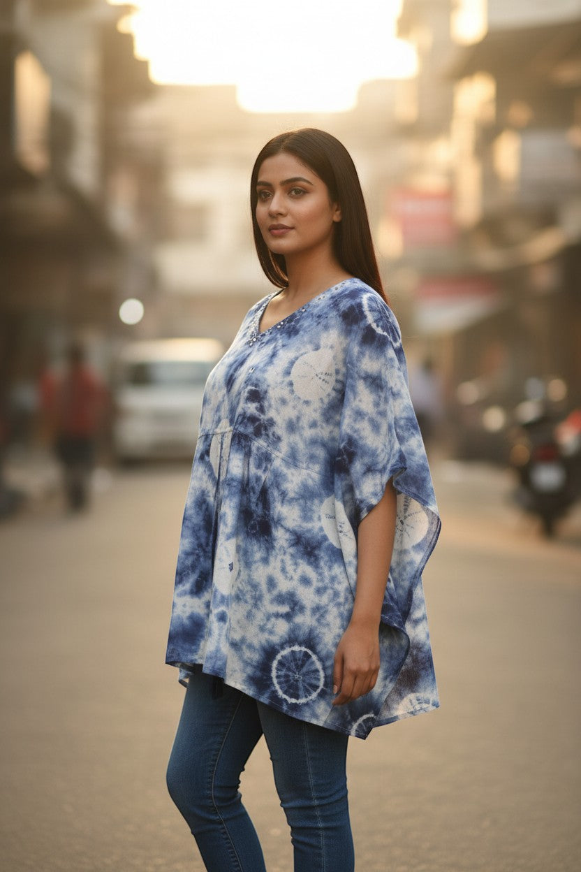 Naanu white and indigo blue shibori tie-dye A-line top with batwing sleeves and mirror work neckline.