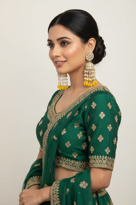 Naanu Kundan Polki Jhumka earrings with pearl and yellow bead drops, gold-tone, intricate floral top.