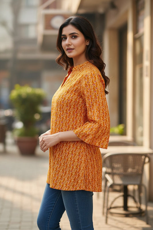 Naanu mustard orange cotton kurti with diamond dot Bandhani print, V-neck, mandarin collar, and 3/4 bell sleeves.