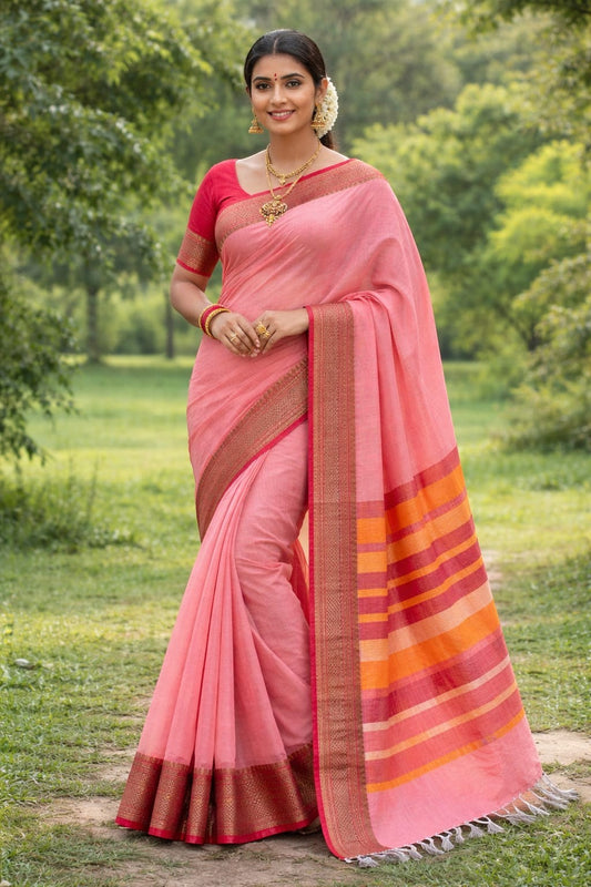 Naanu pink cotton saree with woven geometric border and striped pallu. Model wears traditional jewelry.