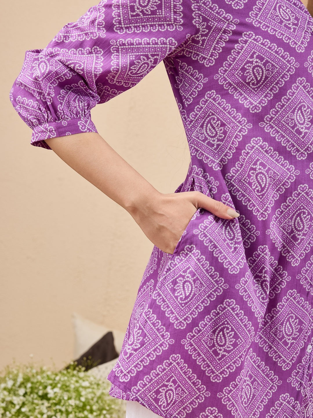 Naanu purple cotton tunic with white bandhani paisley print, puff sleeves, and side pockets.