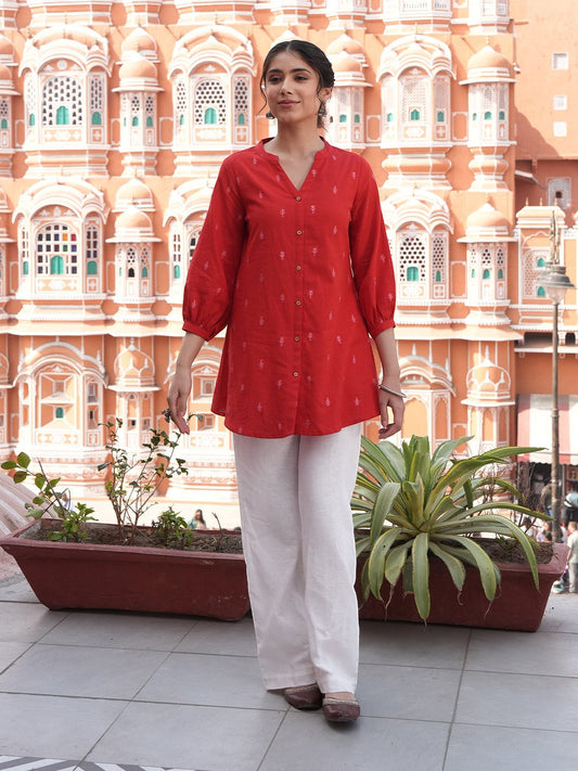 Naanu red cotton tunic with tonal butti print, Mandarin collar, V-notch, button-down front, and 3/4 elasticated sleeves.