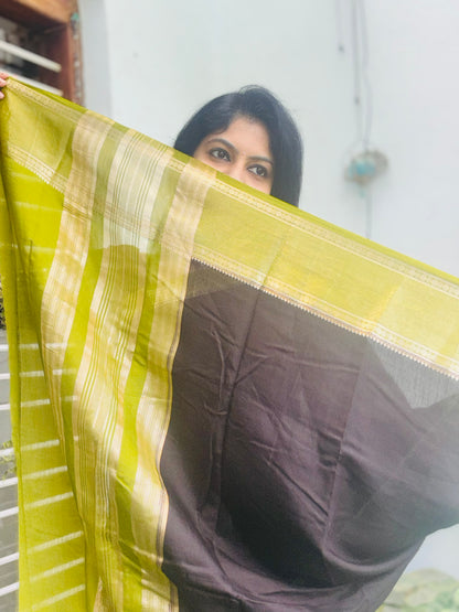 Black and green Assam silk saree - fabric close-up with zari border detail