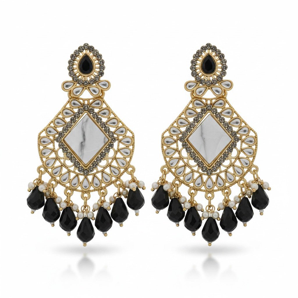 Naanu antique gold chandbali earrings with white marble center, black teardrop crystals, and pearl accents.