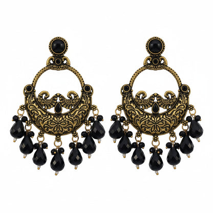 Naanu antique gold chandbali earrings with black stone drops and intricate floral engraving.