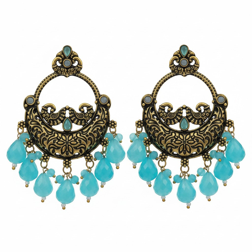 Naanu antique gold chandbali earrings with turquoise stones and lime green jade drops, featuring intricate peacock and floral engraving.
