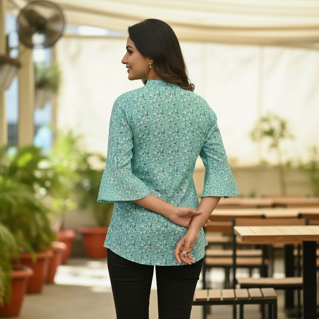 Naanu aqua mint short tunic top with a delicate dark teal floral sprig print, V-neck, and 3/4 sleeves.