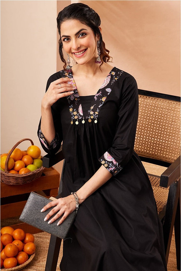 Naanu black A-line kurta with embroidered square neckline and floral print slim pants. 3/4 sleeves with cuff border.