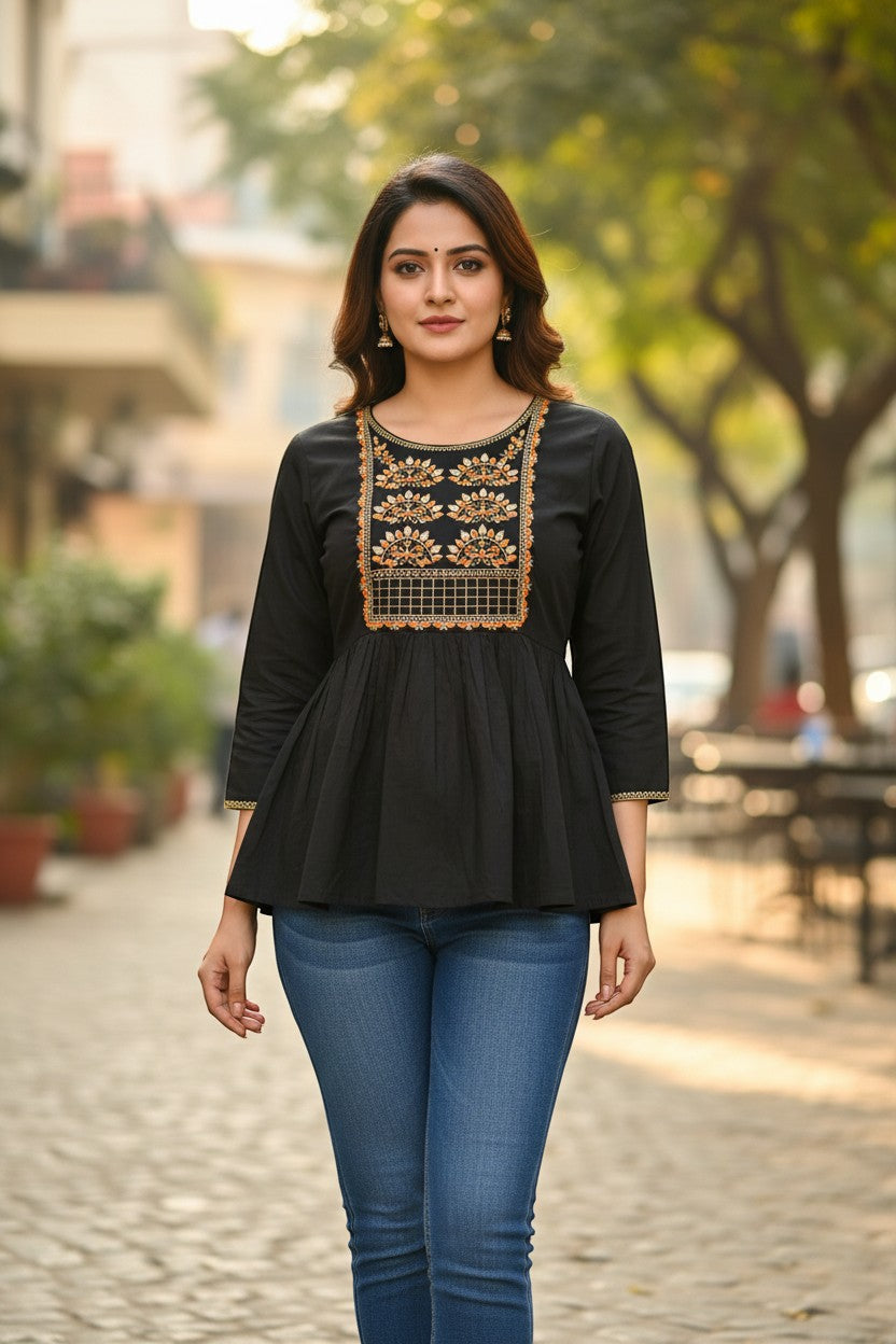 Naanu black cotton peplum kurti with gold zari embroidered peacock yoke and round neckline. 3/4 sleeves.
