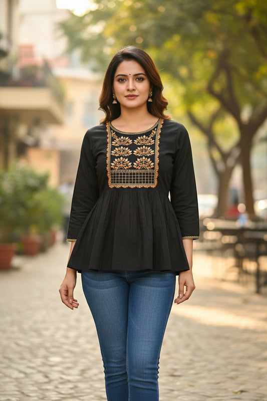 Naanu black cotton peplum kurti with gold zari embroidered peacock yoke and round neckline. 3/4 sleeves.