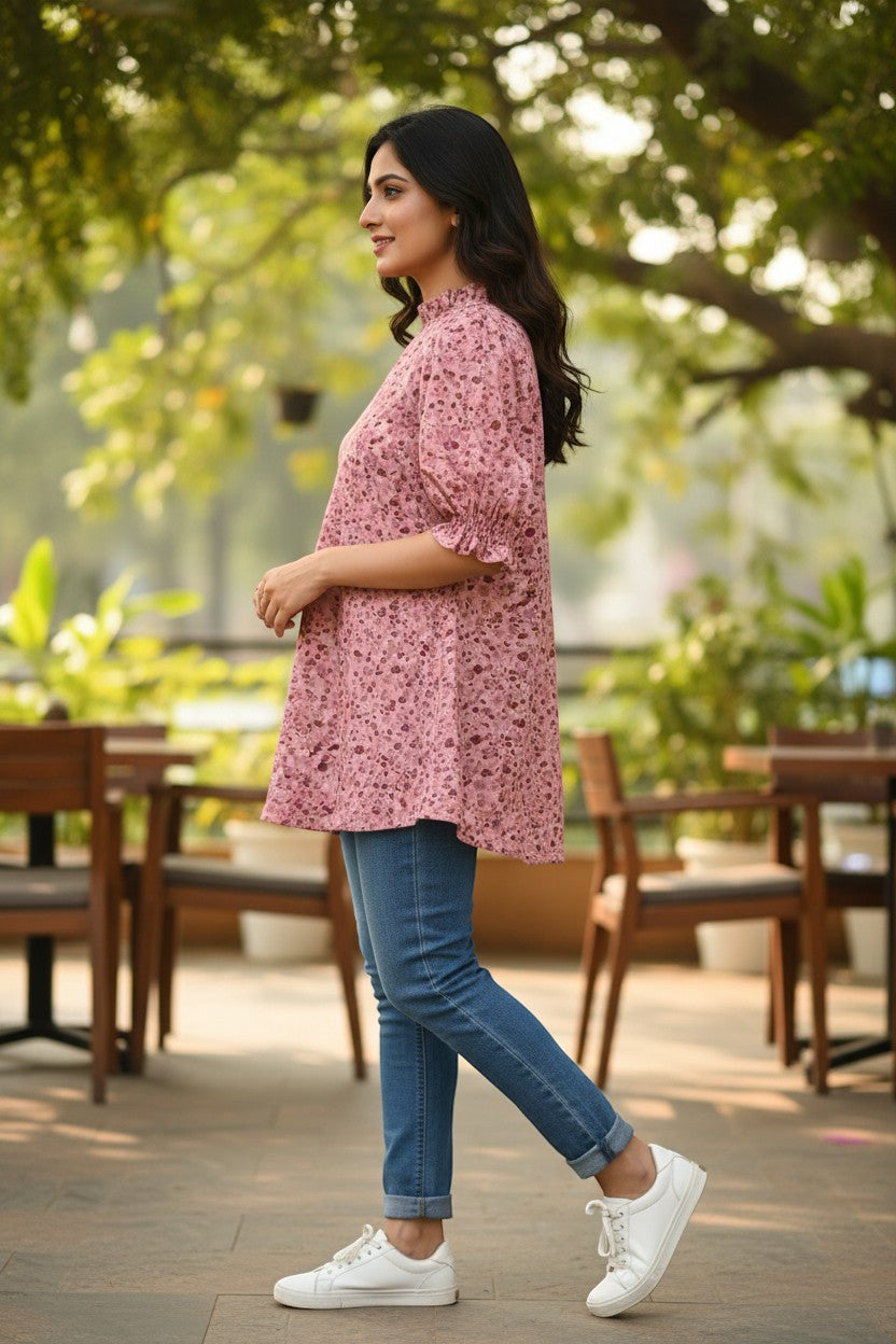 Naanu blush pink ditsy floral mock neck top with ruffle puff sleeves and A-line silhouette.
