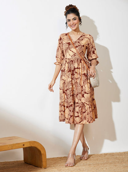 Naanu brown floral midi dress with V-neck, tiered skirt, and puff sleeves. Boho chic style.