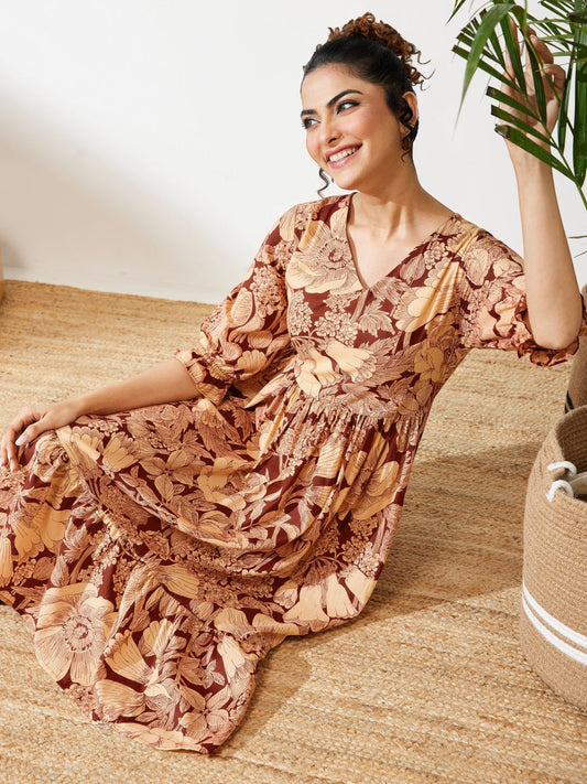 Naanu brown floral midi dress with V-neck, puff sleeves, and tiered skirt. Boho chic ethnic fusion wear.