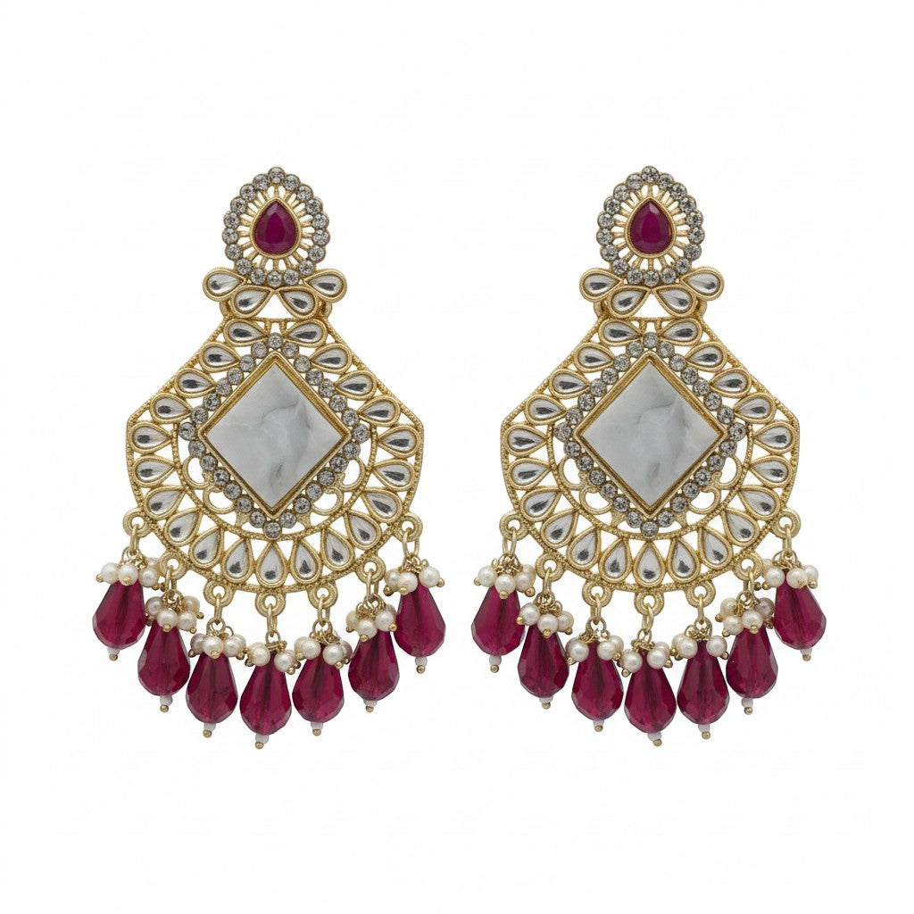 Naanu antique gold chandbali earrings with white polki mirror centre, red teardrop crystals and pearl accents.