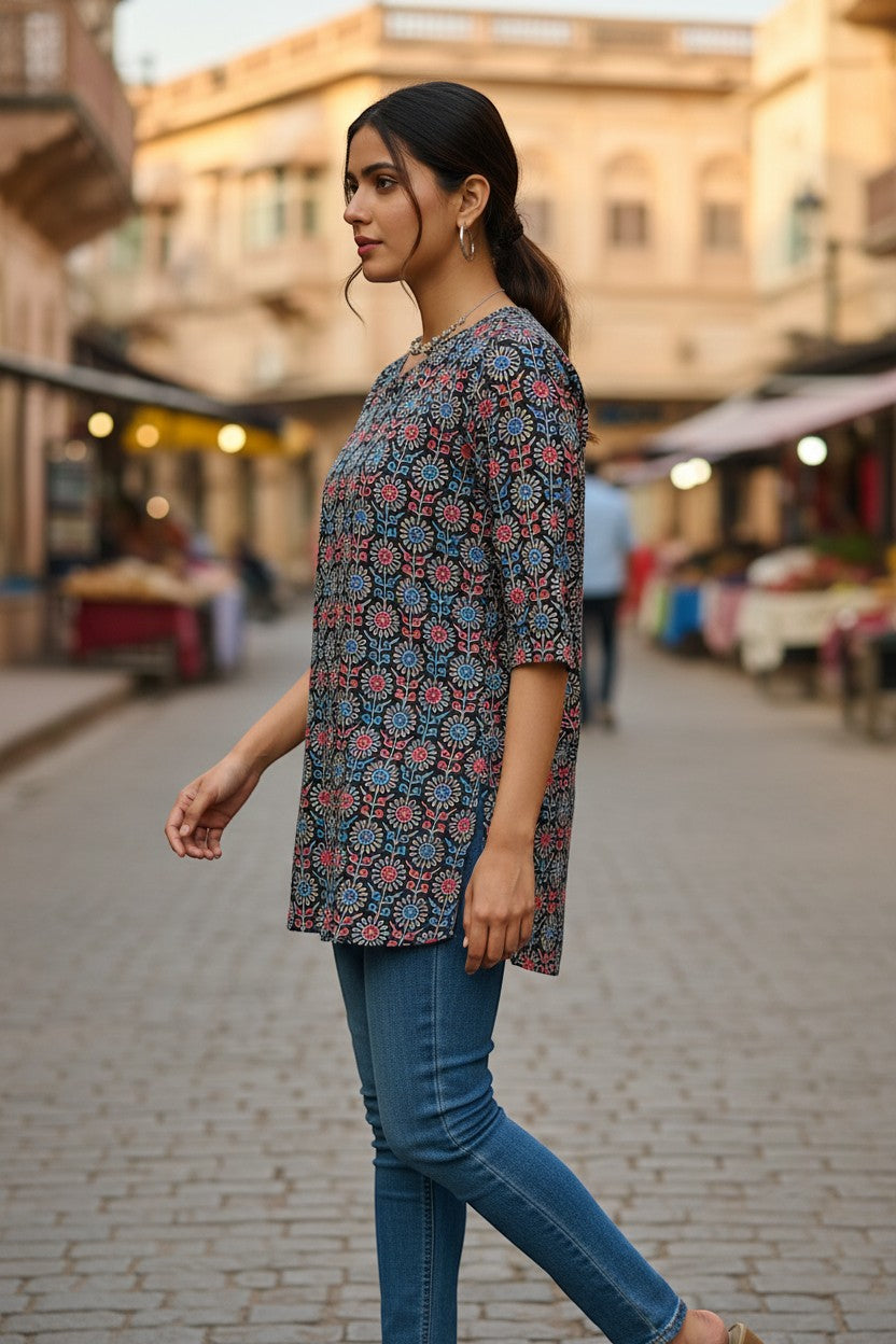 Naanu charcoal black cotton kurti with red and blue Ajrakh geometric medallion print, round neck, 3/4 sleeves.