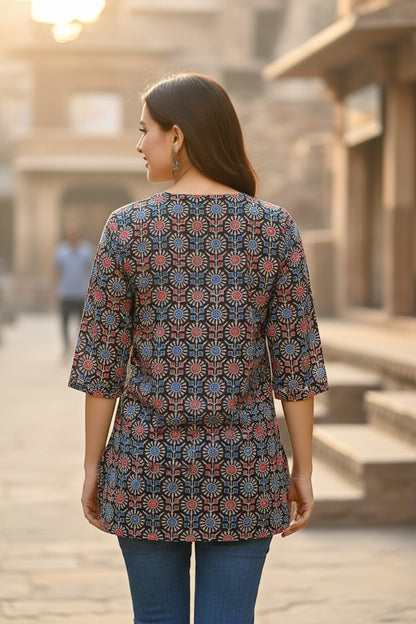 Naanu charcoal black cotton kurti with red and blue Ajrakh geometric medallion print, round neck, 3/4 sleeves.