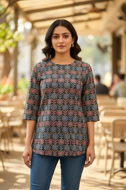 Naanu charcoal black cotton kurti with red and blue Ajrakh geometric medallion print, round neck, 3/4 sleeves.
