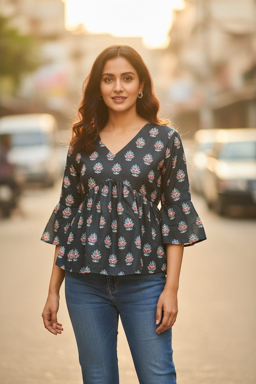 Naanu dark charcoal teal and pink floral block print cotton peplum top with V-neck and bell sleeves.