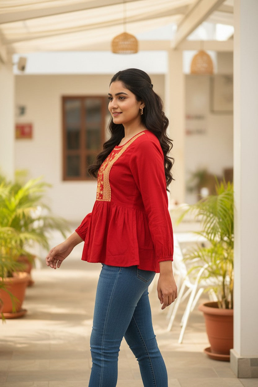 Naanu cherry red rayon peplum top with gold zari tree of life embroidery on yoke, square neck, full sleeves.