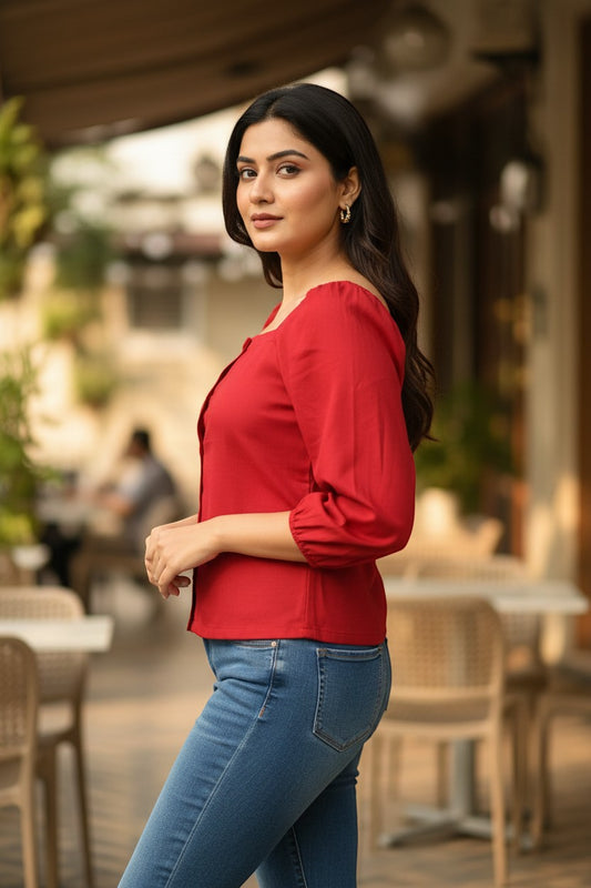 Naanu cherry red polyester short top with square neck, puff 3/4 sleeves, and button-down front, worn by a model with blue jeans.
