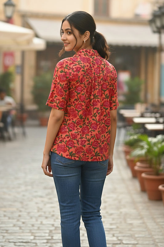Naanu coral orange pink cotton shirt with pomegranate floral block print, V-notch neck, and short sleeves.