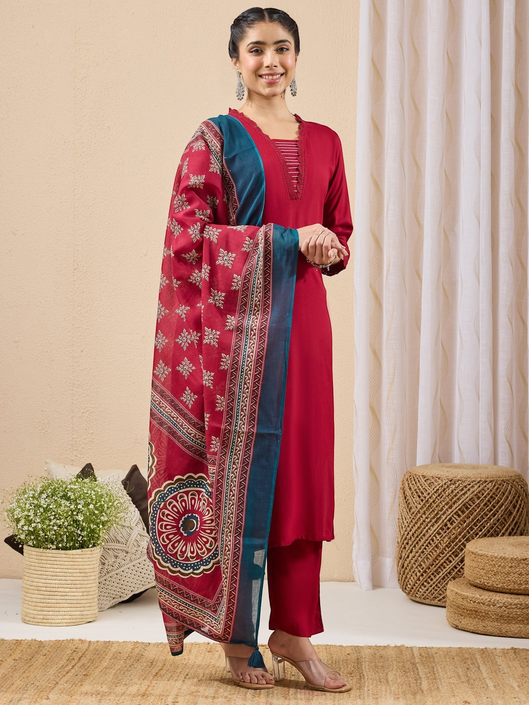 Naanu crimson red 3-piece kurta, pants, and printed dupatta set with lace trim and scalloped neckline.