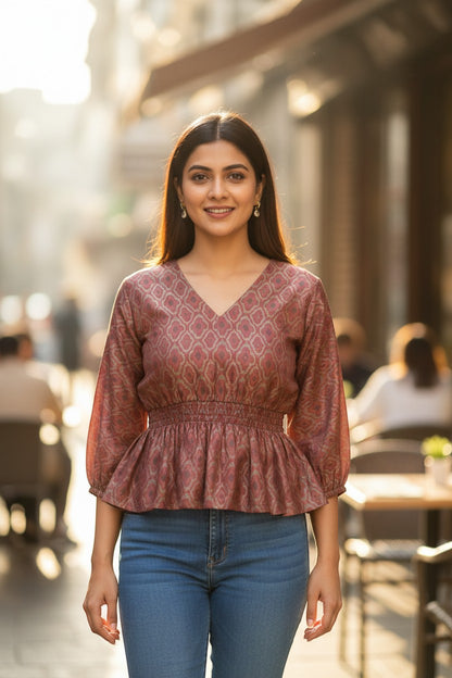 Naanu dusty mauve rose peplum top with geometric diamond jacquard weave, deep V-neck, and 3/4 sleeves.