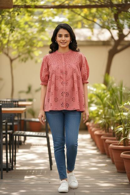 Naanu dusty rose pink cotton top with schiffli cutwork embroidery, mandarin collar, button front, and puff sleeves.
