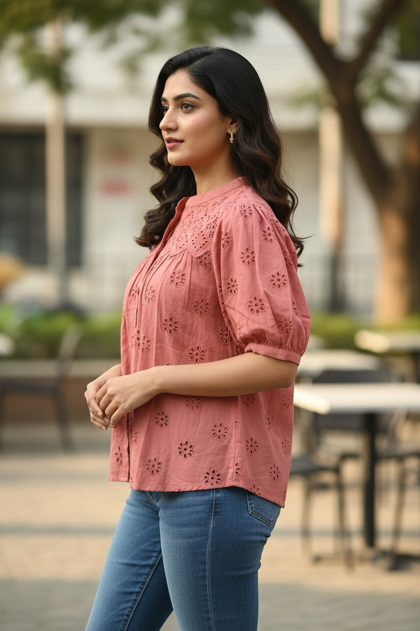 Naanu dusty rose pink cotton top with schiffli cutwork embroidery, mandarin collar, button front, and puff sleeves.