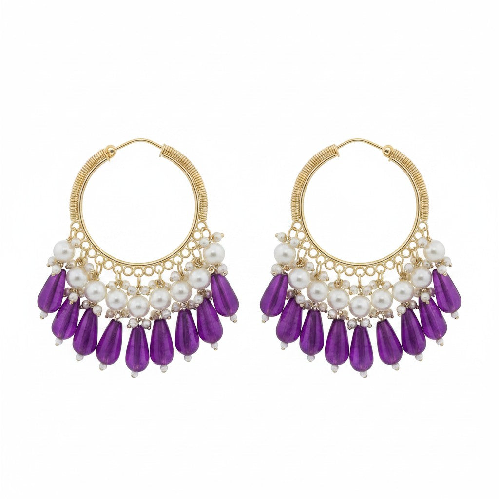 Naanu gold hoop earrings with white pearl clusters and purple crystal teardrop drops, featuring a coiled hoop design.