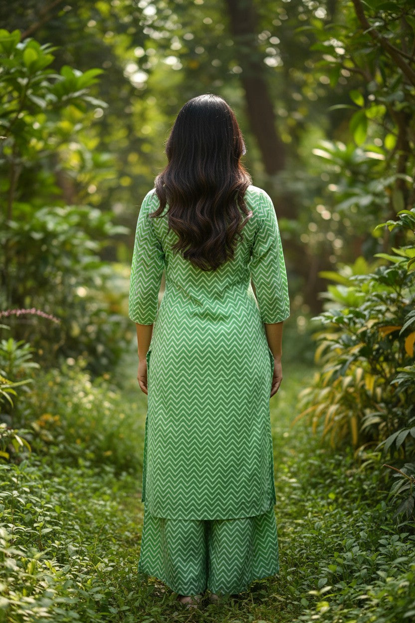 Naanu green and white chevron print straight kurta with 3/4 sleeves and matching pants, styled for casual wear.