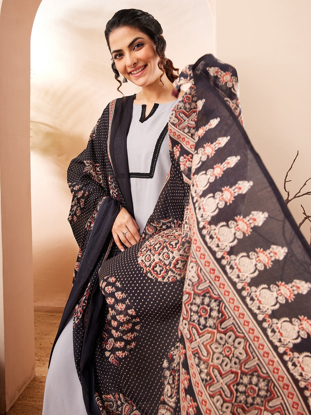 Naanu grey rayon straight kurta set with black contrast border and printed dupatta.