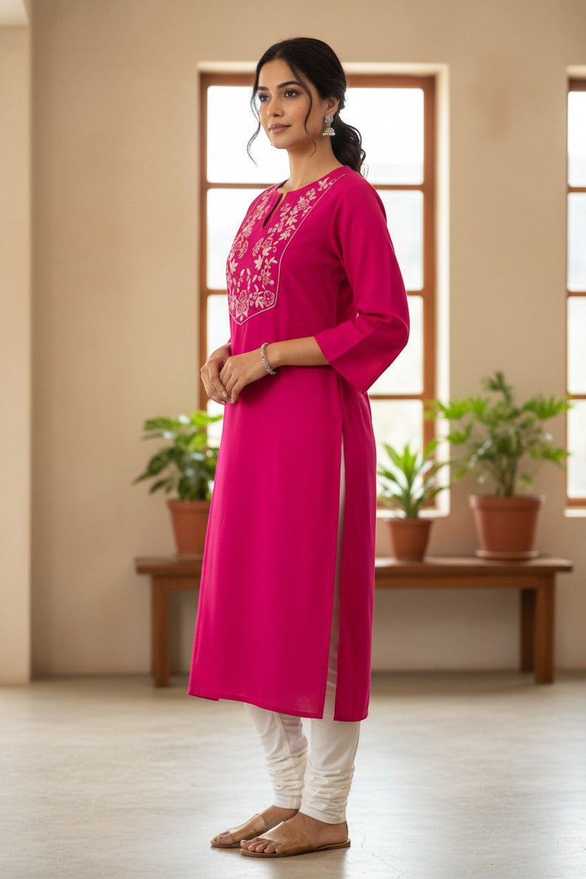 Naanu hot pink cotton kurta with white floral bird embroidery on V-yoke, 3/4 sleeves, and side slits.
