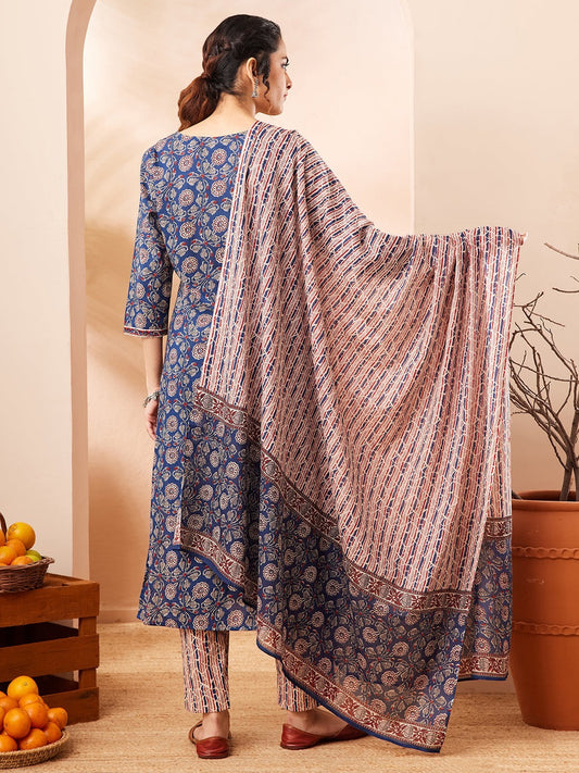 Naanu Indigo blue cotton 3-piece Ajrakh block print kurta, pants, and dupatta set with floral motifs and striped patterns.