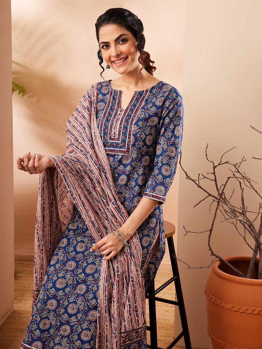 Naanu Indigo Blue Ajrakh block print cotton kurta, pants, and dupatta set with floral motifs and striped dupatta.