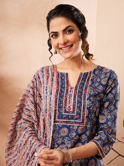 Naanu Indigo blue cotton 3-piece Ajrakh block print kurta set with slim pants and dupatta. Features floral motifs and striped patterns.