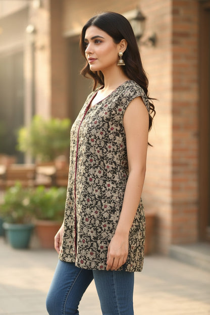 Naanu dark olive black cotton top with cream gold jasmine floral print and magenta piping. Sleeveless, V-neck, short length.