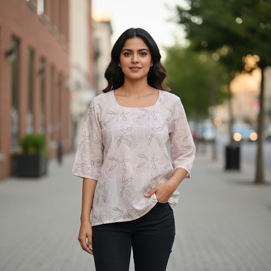 Naanu soft lavender grey cotton top with all-over grey leaf embroidery, scoop neck, and 3/4 sleeves.