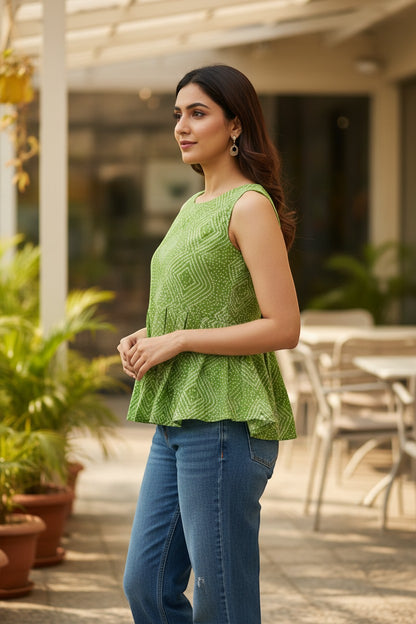 Naanu lime green cotton sleeveless peplum top with white Bandhani diamond dot print and scoop neck.