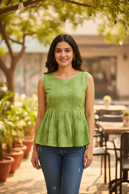 Naanu lime green cotton sleeveless peplum top with Bandhani diamond dot print and scoop neck.
