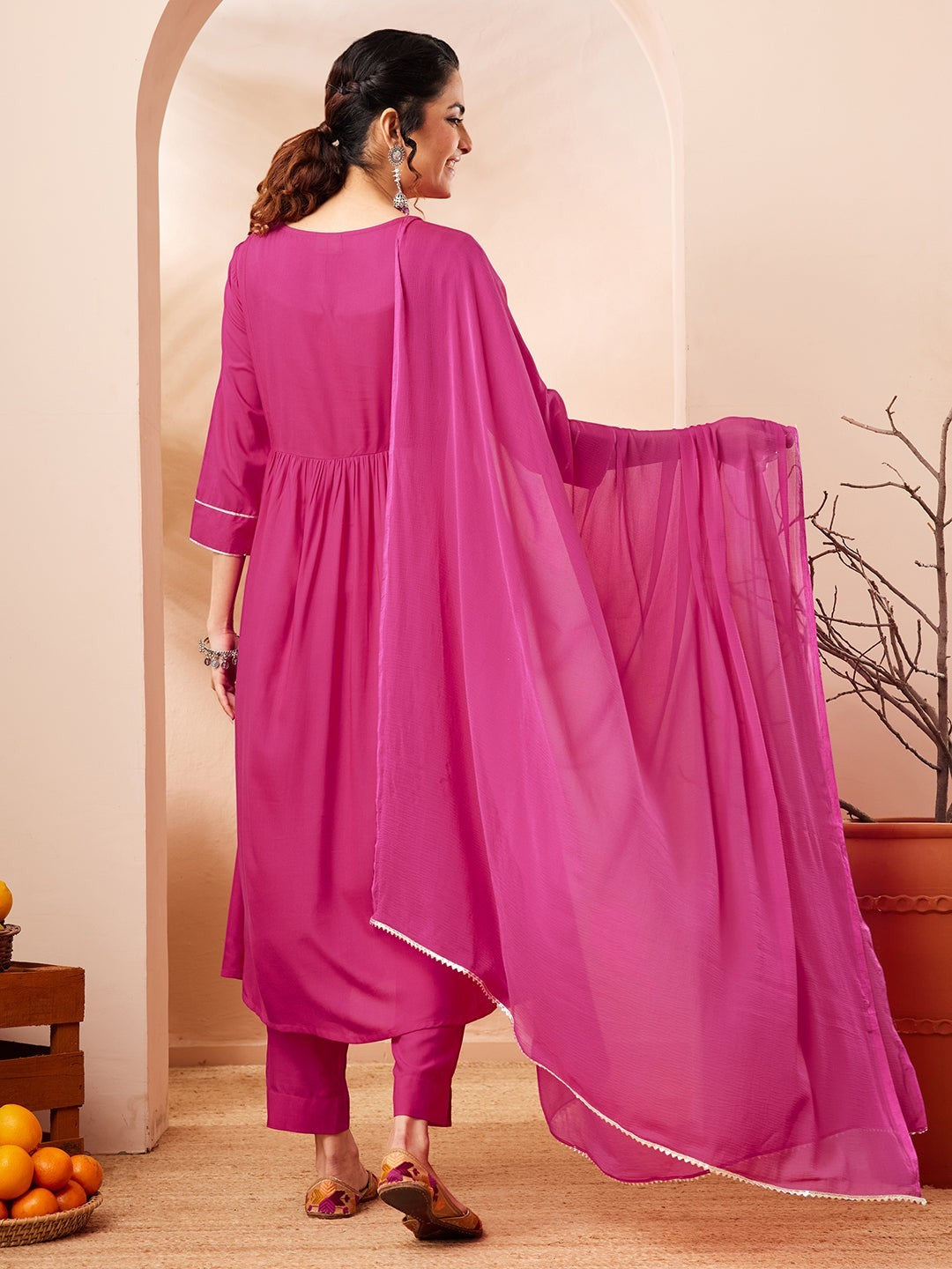 Naanu magenta Anarkali kurta set with white butti embroidery, lace trim, slim pants, and chiffon dupatta.