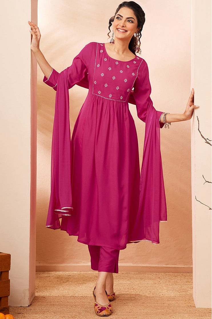 Naanu magenta Anarkali kurta set with white butti embroidery, lace trim, slim pants, and chiffon dupatta.