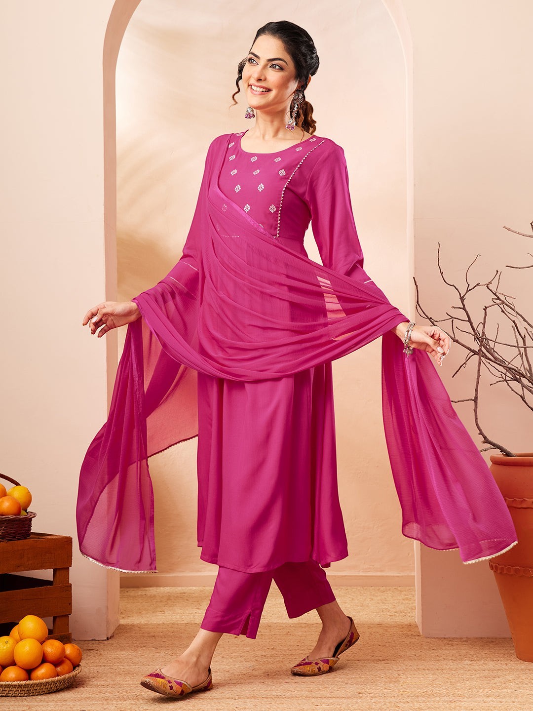 Naanu magenta Anarkali kurta set with white butti embroidery, lace trim, slim pants, and chiffon dupatta.