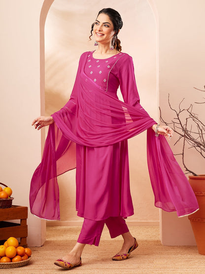 Naanu magenta Anarkali kurta set with white butti embroidery, lace trim, slim pants, and chiffon dupatta.