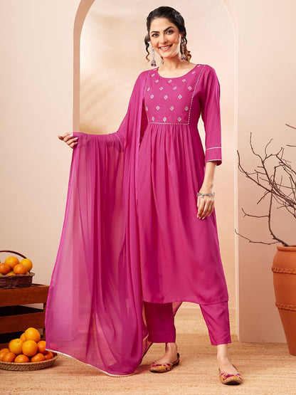 Naanu magenta Anarkali kurta set with white butti embroidery on yoke, 3/4 sleeves, slim pants, and chiffon dupatta with lace trim.